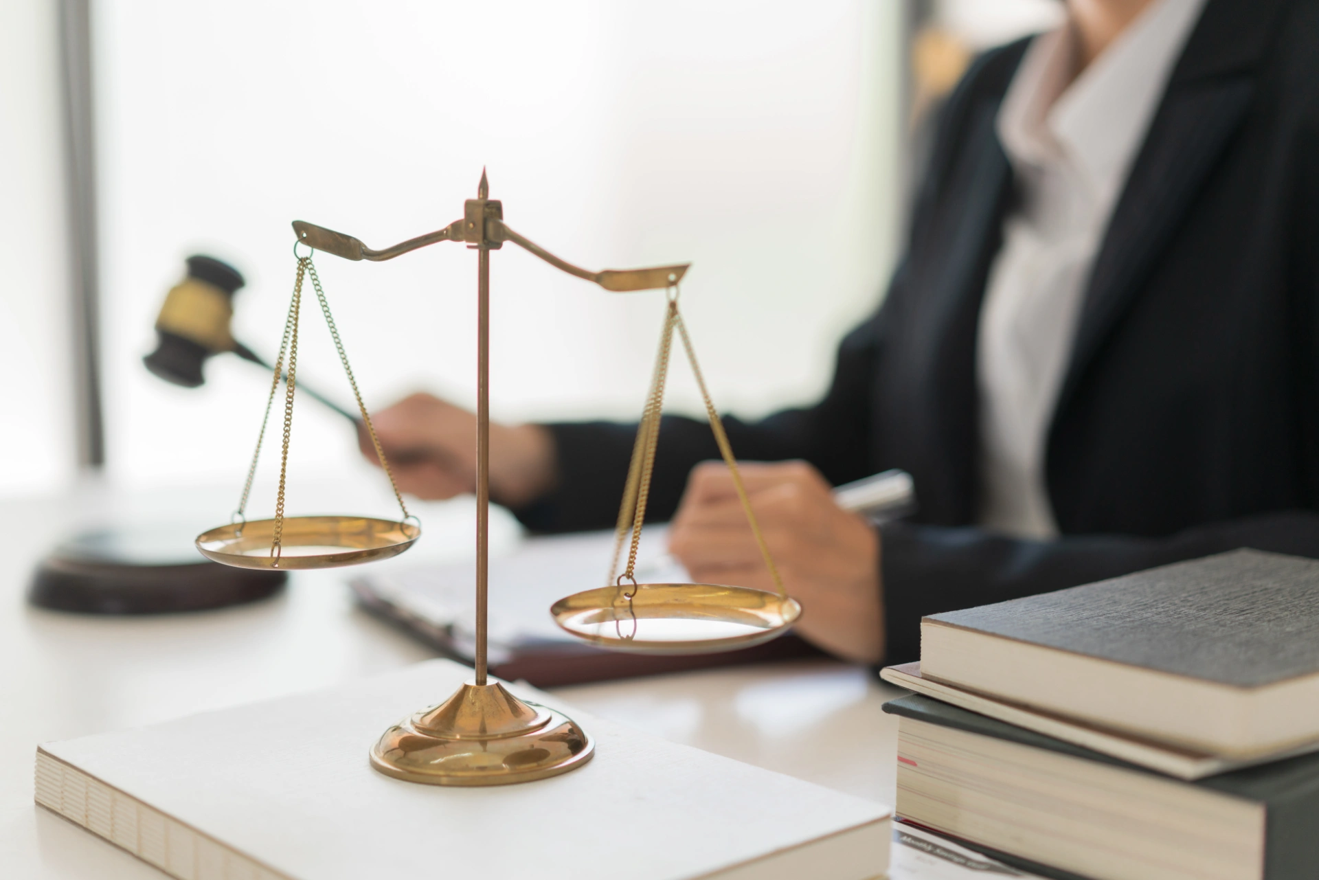 law concept female lawyer holds hammer and writes